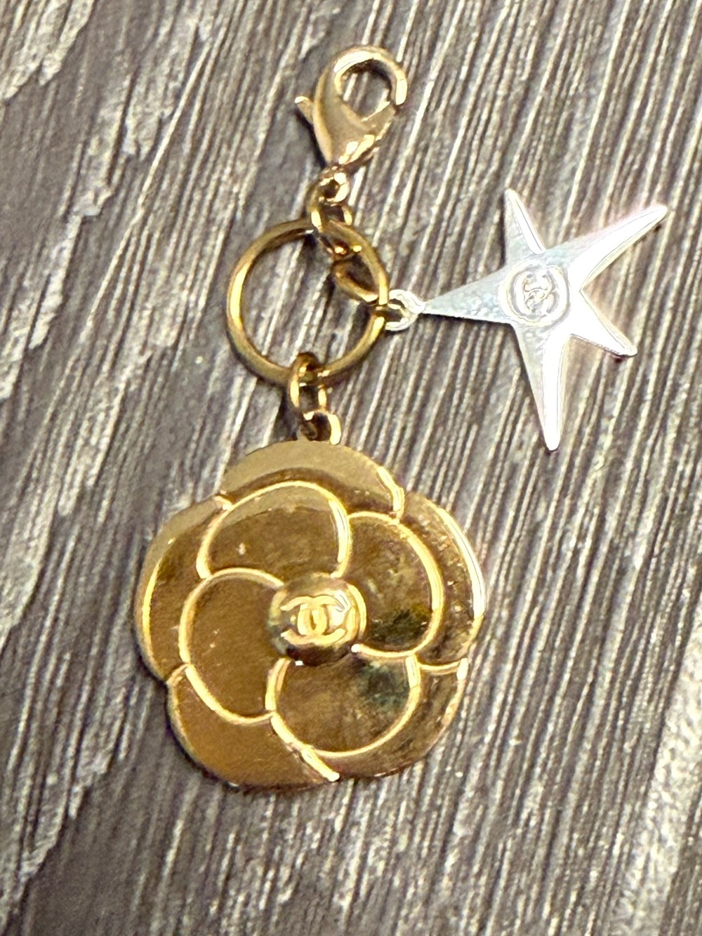 CHANEL Gold Camellia and Star Charm Bracelet Accent